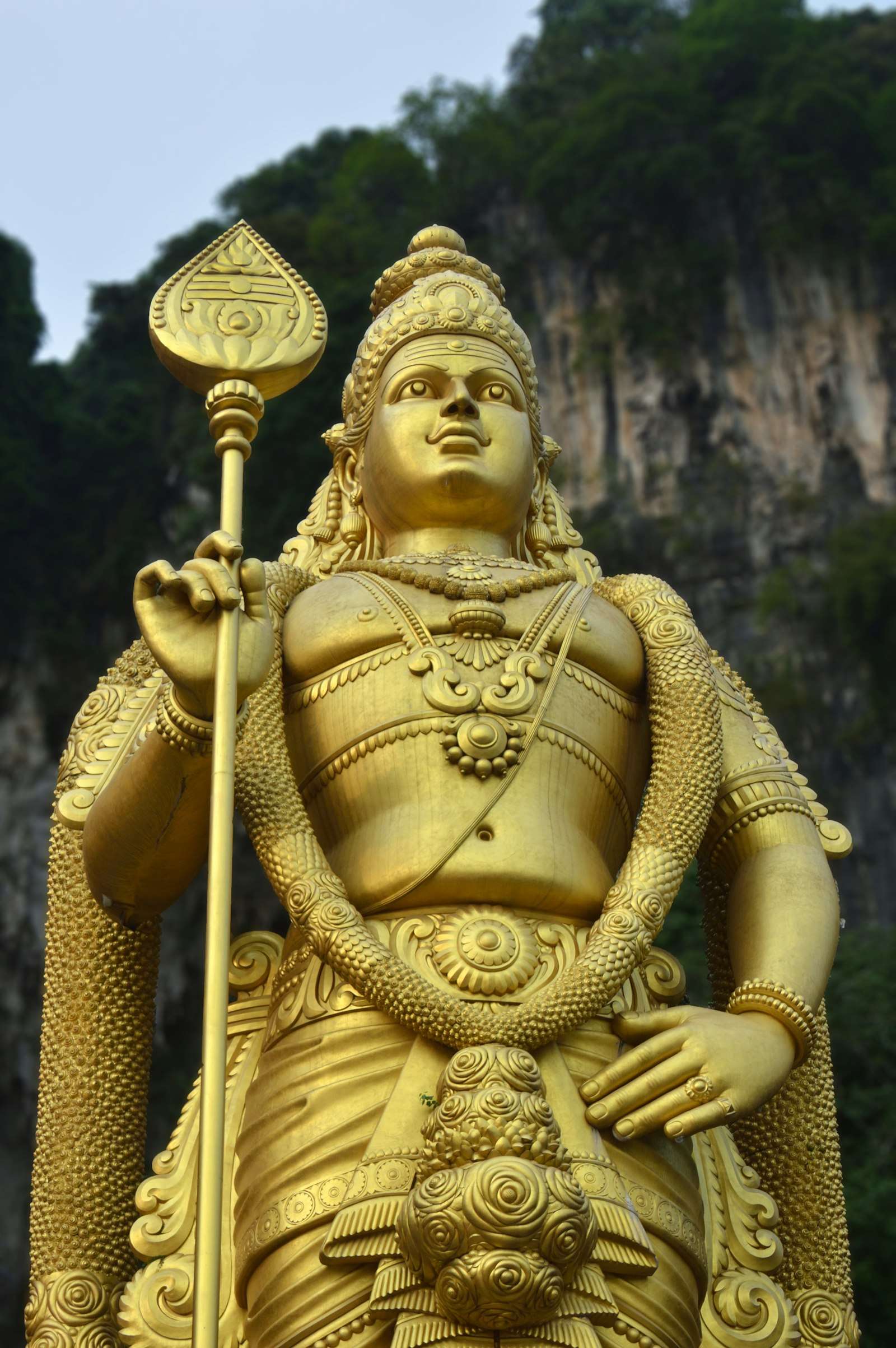 Monumental golden Murugan statue