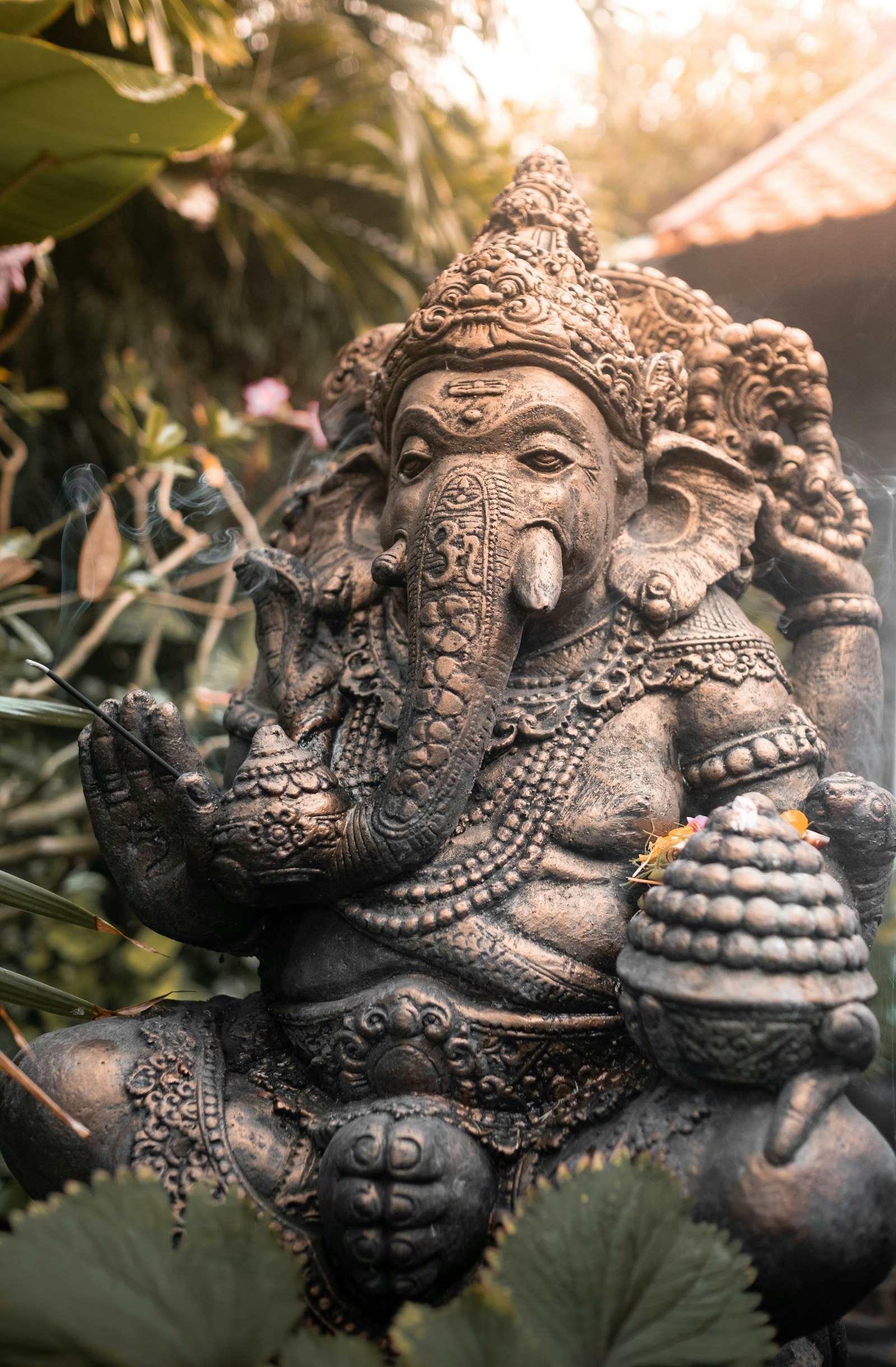 Weathered stone Ganesha statue with carved detail